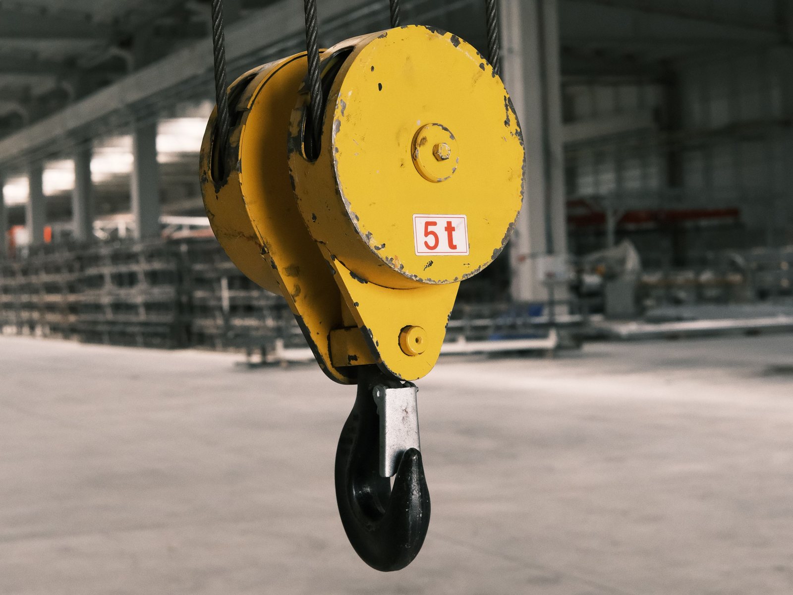 5 tonne overhead crane hook block in a steel workshop
